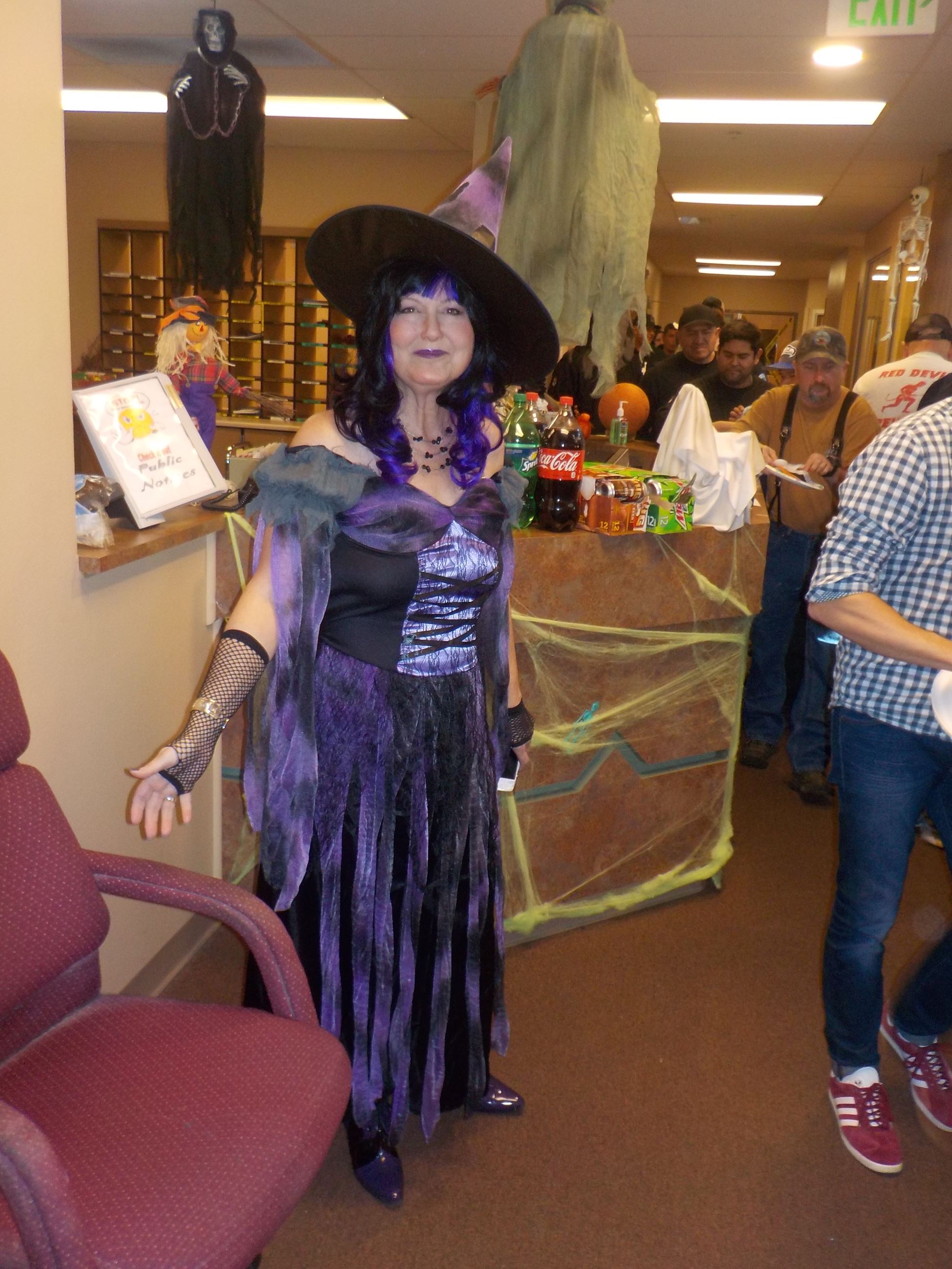 A woman dressed as a witch
