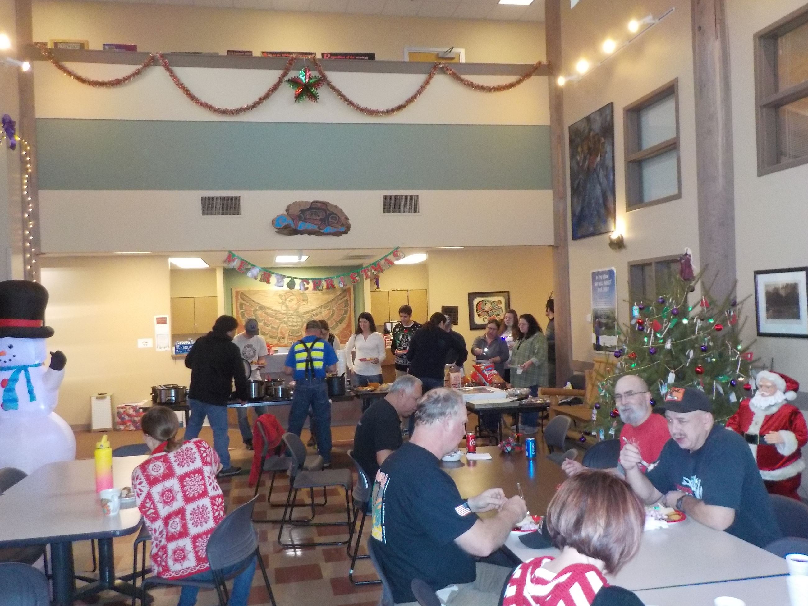 People at a food buffet getting and eating food