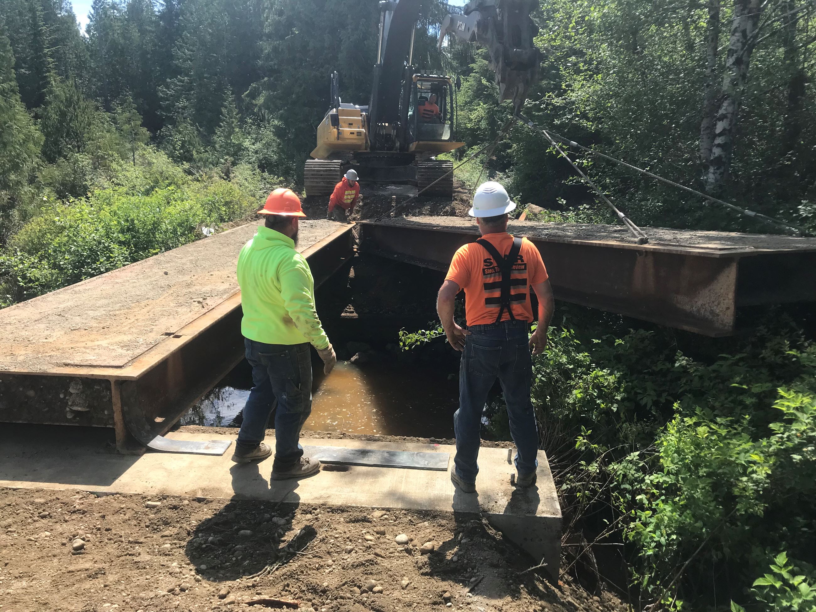 Two staff monitoring construction work.