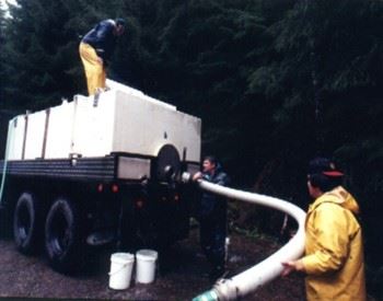 truck and hose completing release of hatchery fish