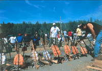A group of people cooking salmon