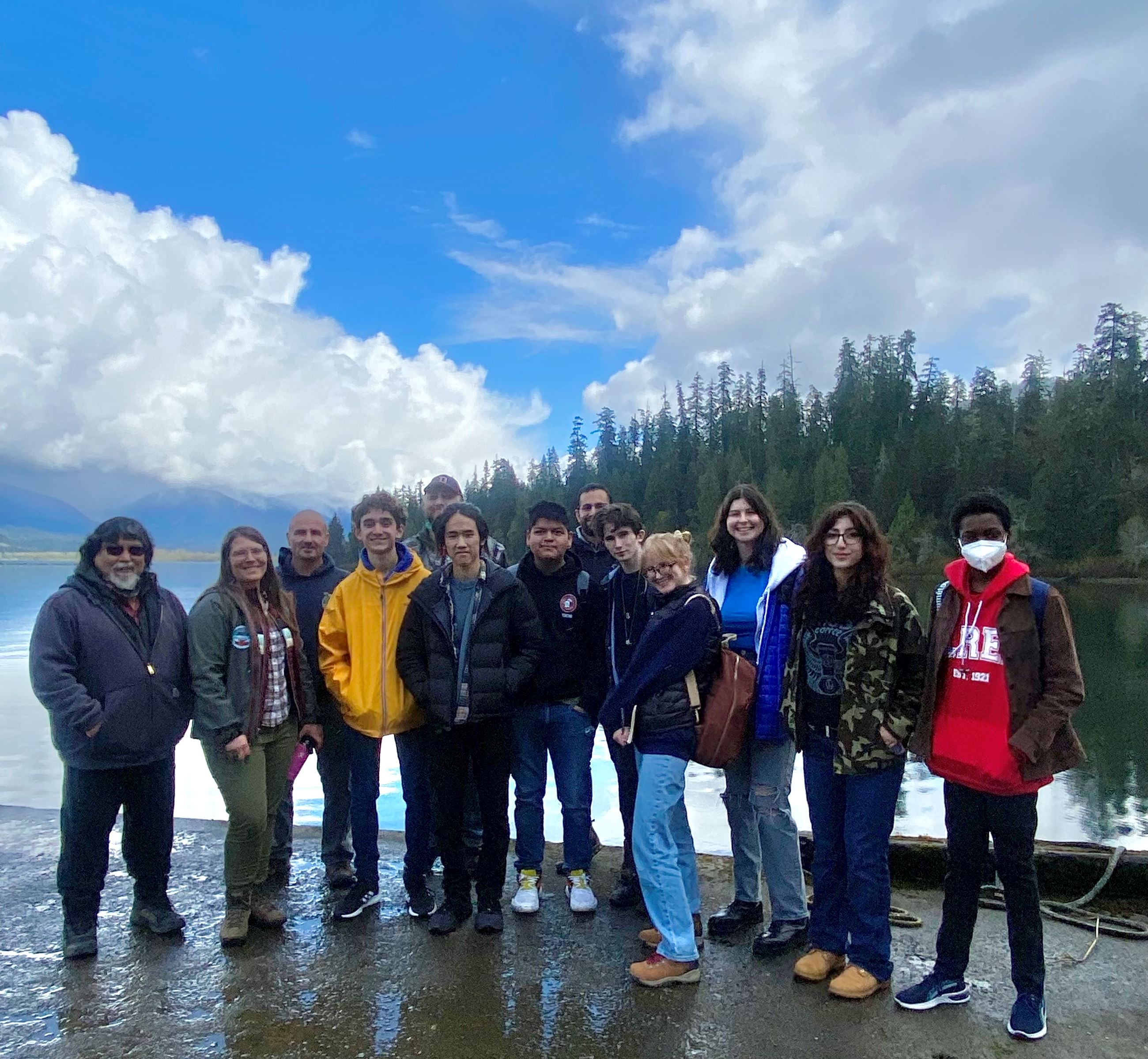group of people taking a photo on a beach