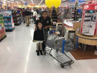 Officer shopping with child
