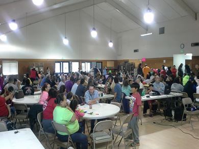 People sitting at tables in a meeting